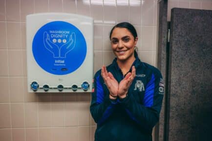 Georgia Ravics, the Canterbury-Bankstown Head of Retail, promoting the Washroom Dignity initiative at the NRL club.