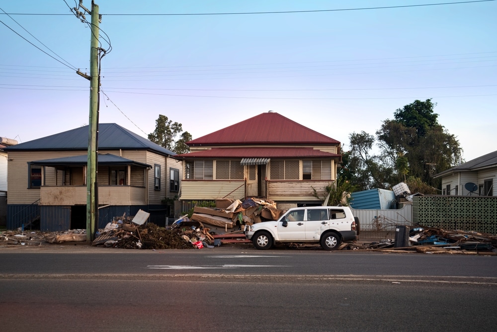 Lismore, New South Wales, Australia; 22.03.2022: residential houses with severe water damage and piles of garbage by the roadside after the 2022 east coast floods in Australia