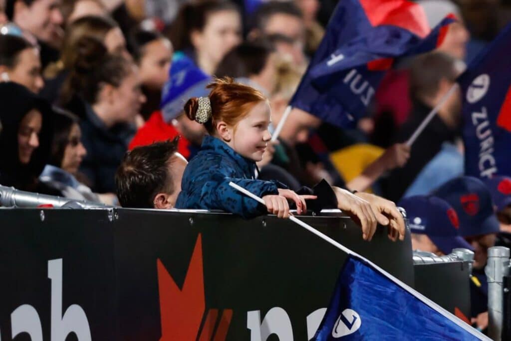 Young girl in the crowd at an AFLW Season 8 Round 1 match. Credit: Twitter