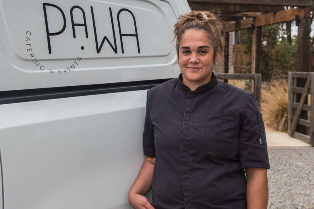 Niyoka Bundle standing in front of the Pawa Catering van. Credit: Supplied