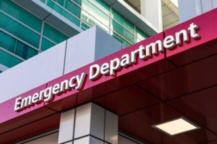 Emergency Department sign above hospital