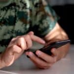 Man scrolling on phone