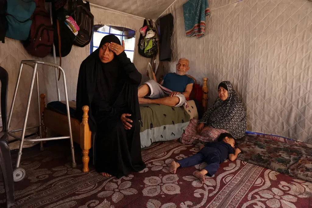 Nearly a quarter of a million women and girls in Gaza are starving. Each day begins with the same desperate question: where will I find food and water? Featured in this photo, Fullah Ziyad Khalil Arafat is responsible for caring and providing for eight people now, including her husband's parents and her five children. Photo: UN Women